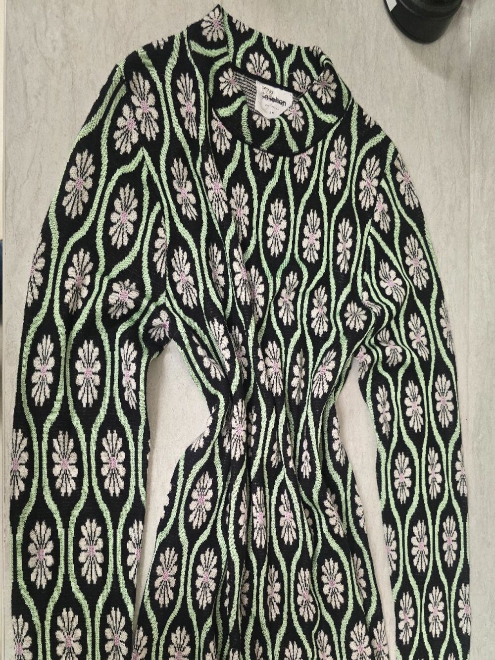 Callahan black knit sweater with white and light green floral pattern, size S/M